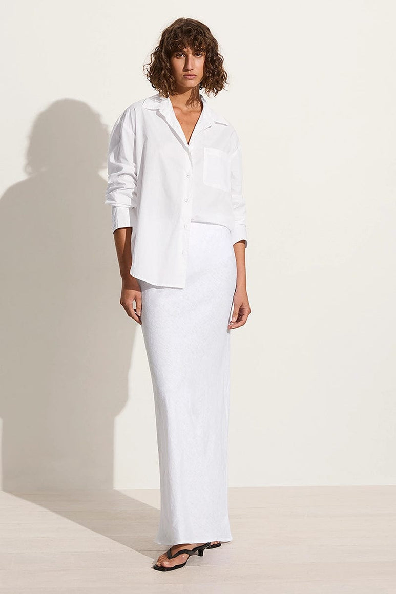 Title: Embracing the Power of Minimalism: The Subtle Allure of a White Blouse and Black Suit for Women